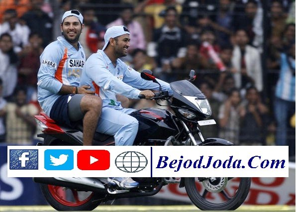 Indian cricketer Mahindra Singh Dhoni (R) rides the motorcycle awarded as a prize to teammate and man of the match Yuvraj Singh (L) who rides pillion during the second One Day international (ODI) match between England and India in Indore on November 17, 2008. Hosts India defeated England by 54 runs to take a 2-0 lead in the seven-match one-day series. AFP PHOTO/RAVEENDRAN (Photo credit should read RAVEENDRAN/AFP/Getty Images)